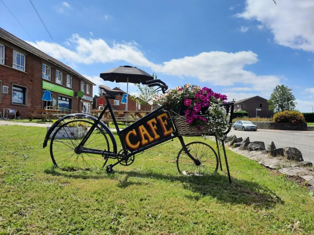Cafe sign in place in the garden